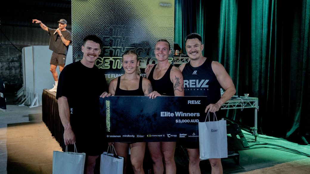 The Elite winners on stage with their cheque